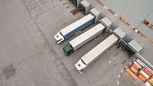 trucks_unloading_in_logistics_center_res_s.jpg